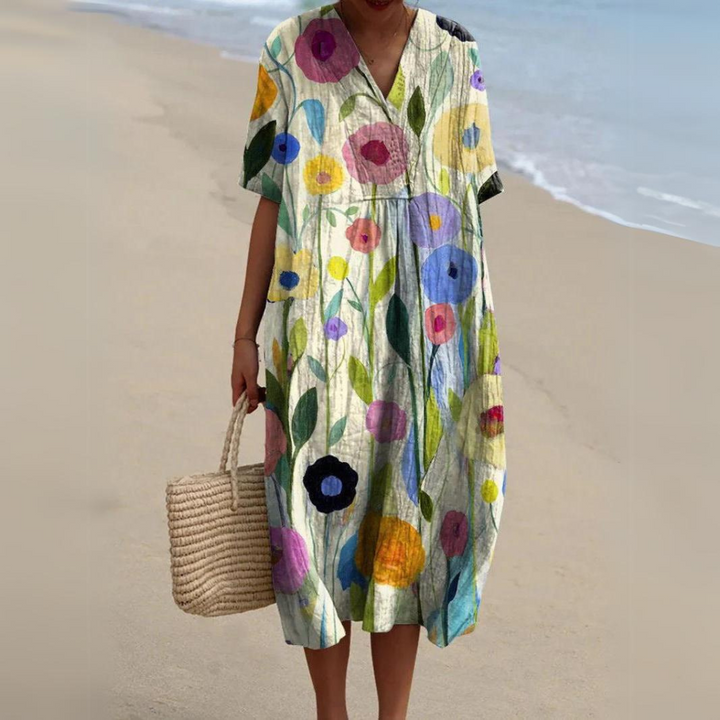 Stilvolles Damen Boho Strandkleid mit Blumen, Midi-Länge & V-Ausschnitt. Luftiges Freizeitkleid für den Sommer.