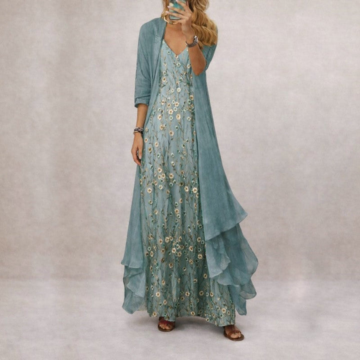 Beiges Damen Maxikleid mit blauem Blumenmuster, V-Ausschnitt, ärmellos. Elegantes langes Sommer Freizeitkleid.