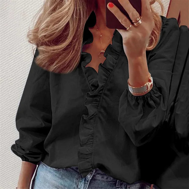Feminine Damenbluse mit eleganten Rüschen und langen Ärmeln. Perfekt als Alltagsbluse für Frühling/Sommer.