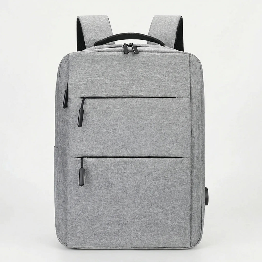 Eleganter grauer Laptop-Rucksack mit USB-Anschluss, ergonomischem Design & vielen Organisationsfächern.