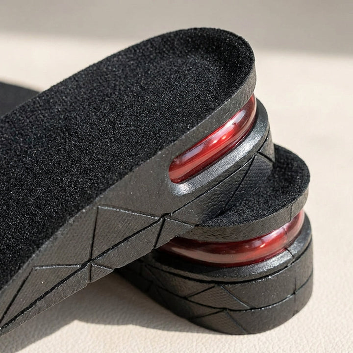 Schwarze Unisex Schuheinlagen mit diskreter Höhenverstellung, bieten Komfort und Unterstützung für das Fußgewölbe.