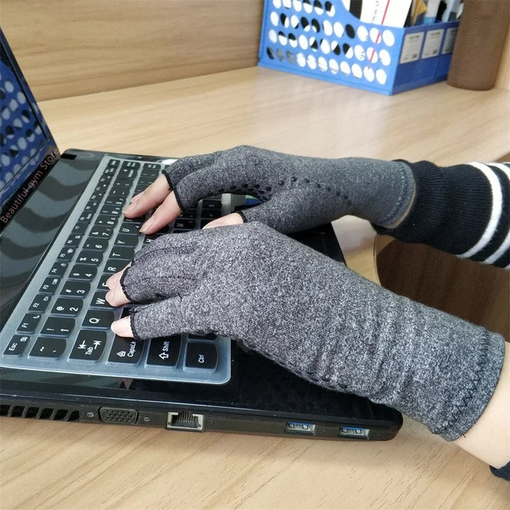 Grauer fingerloser Kompressionshandschuh, vielseitig für Arthritis, Karpaltunnel & allgemeine Schmerzlinderung.