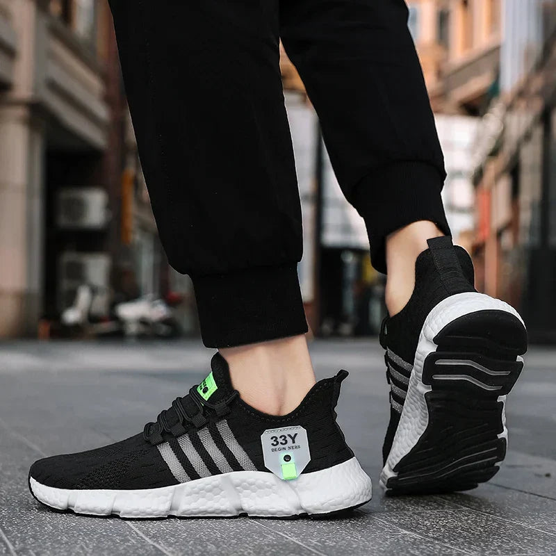 Detailaufnahme des atmungsaktiven Mesh-Obermaterials der Ventrel Herren-Laufschuhe, fördert maximale Luftzirkulation.