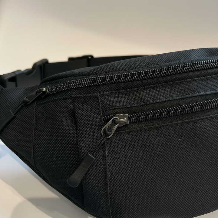 Robuste schwarze Unisex Hüfttasche aus Oxford-Stoff, vielseitig für Reise und Alltag.