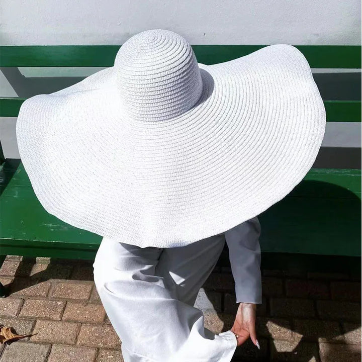 Marineblauer Damen XXL Sonnenhut, faltbar. Breiter Krempe, elegante Kopfbedeckung im Sommer.