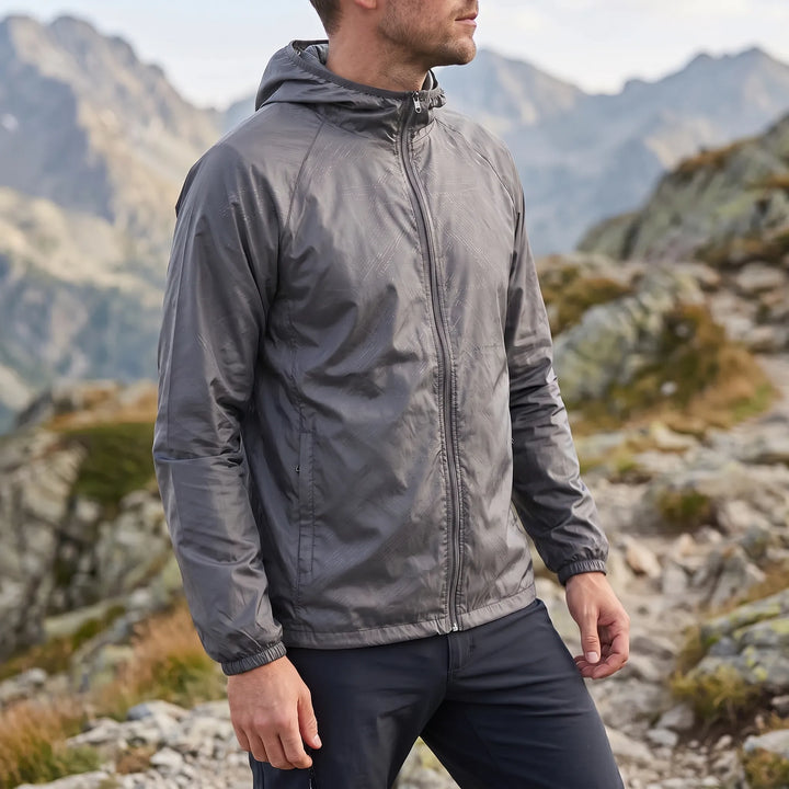 Vielseitiger unisex Windbreaker, leicht, packbar, mit Kapuze, für alle Outdoor-Herausforderungen.