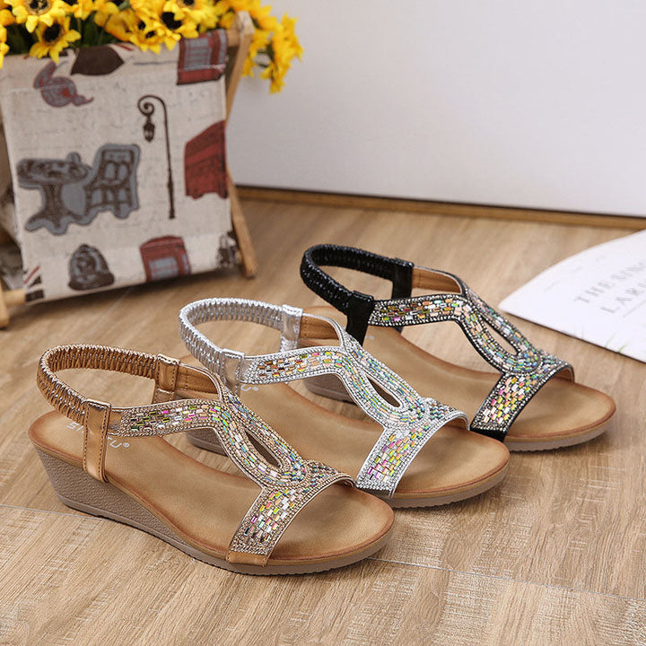 Stilvolle schwarze Damenschuhe mit Keilabsatz, glitzernd, für elegante Sommer-Outfits.