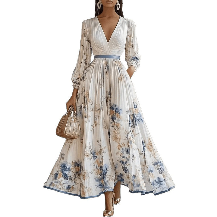 Damen Maxikleid mit femininen Puffärmeln & V-Ausschnitt. Elegantes Blumenmuster, lang und fließend.