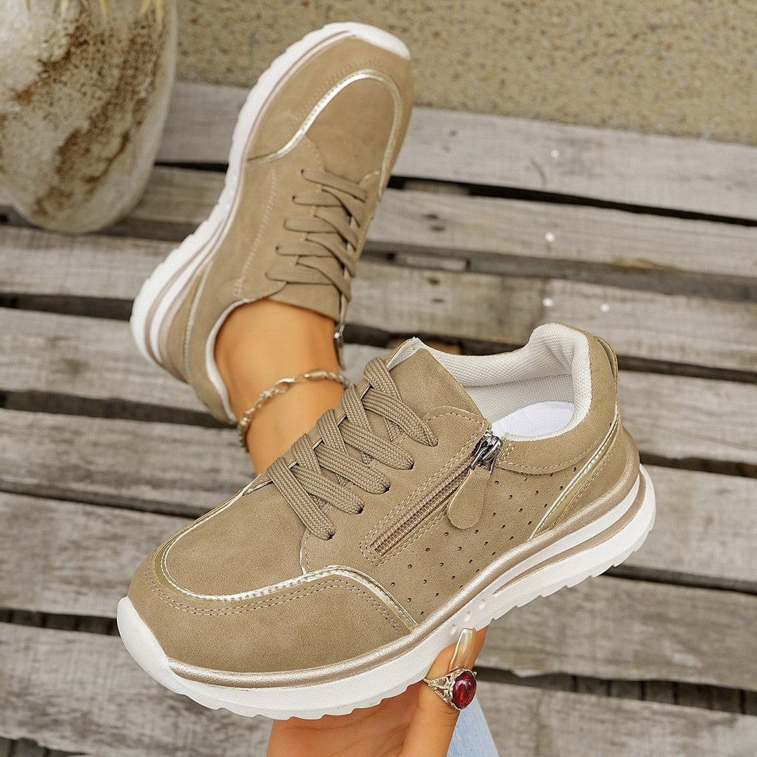 Stylische Damen-Sneakers, ideal als Freizeitschuhe. Mit Reißverschluss und bequemer Fußgewölbestütze ausgestattet.