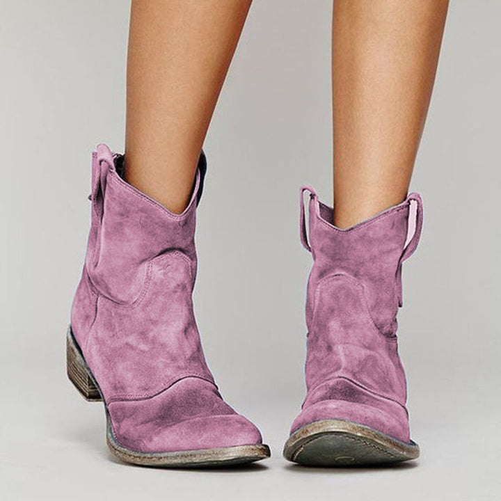 Moderne Damen Western-Stiefeletten mit markantem Blockabsatz und strapazierfähiger, rutschfester Laufsohle.