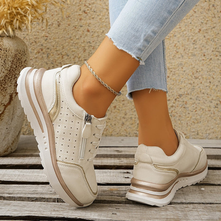 Moderne Damen-Sneakers mit praktischem Reißverschluss und integrierter Fußgewölbestütze für optimalen Halt.