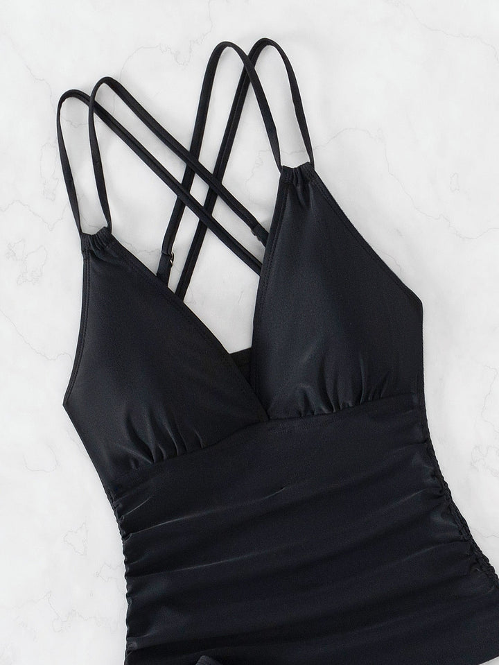 Blauer Damen Tankini mit V-Ausschnitt und Kreuzträgern, modische Strandmode für den Urlaub.