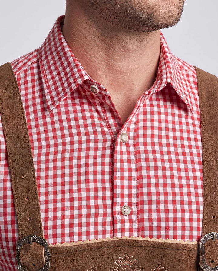 Dunkelbraune Herrenlederhose im rustikalen Stil, perfekt für bayerische Volksfeste und Trachtenmode.