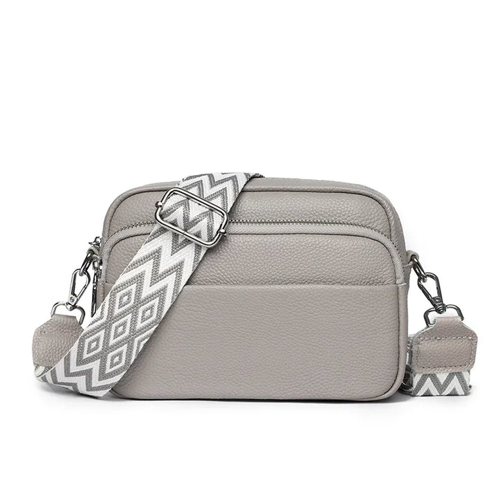 Beige elegante Damen-Ledertasche, vielseitig als Schulter- oder Handtasche nutzbar.