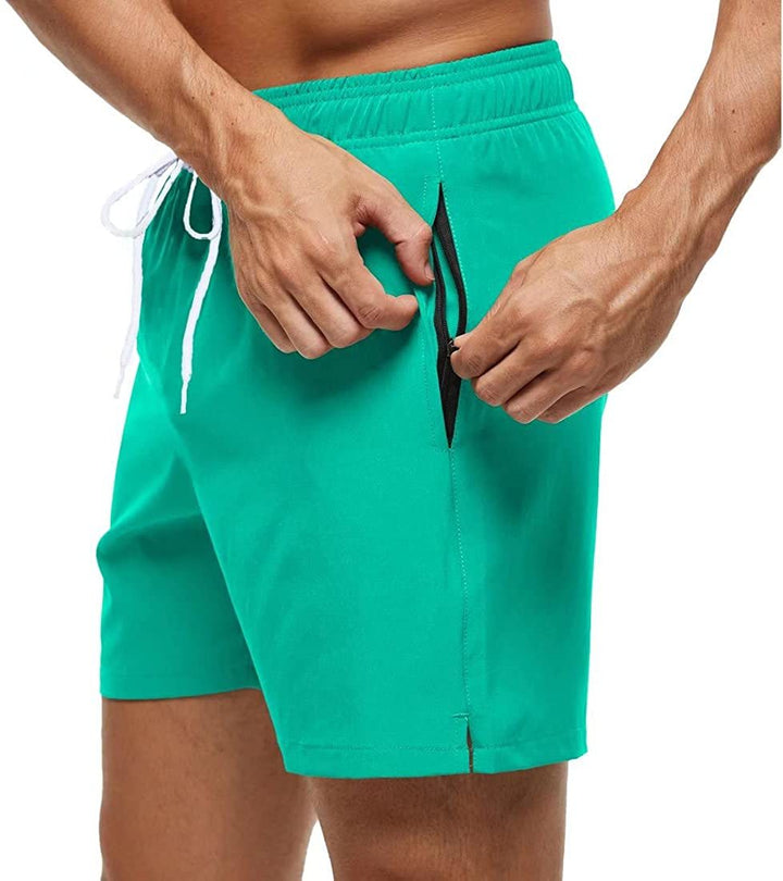 Schnelltrocknende Herren Badeshorts für Sport & Urlaub. Mit Kordelzug & Reißverschlusstasche für Komfort.
