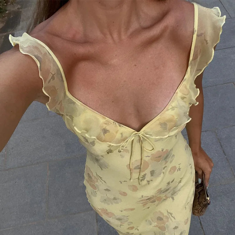 Rückenfreies, langes Damen Sommerkleid mit floralem Muster. Ideal als elegantes Urlaubs- oder Strandkleid.