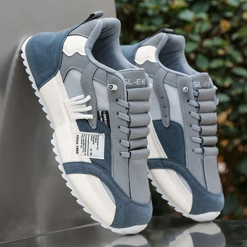 Dunkelgraue Herren Knöchelstiefel mit robuster Spritzgusssohle. Ideal als bequeme Alltagsschuhe für Männer.