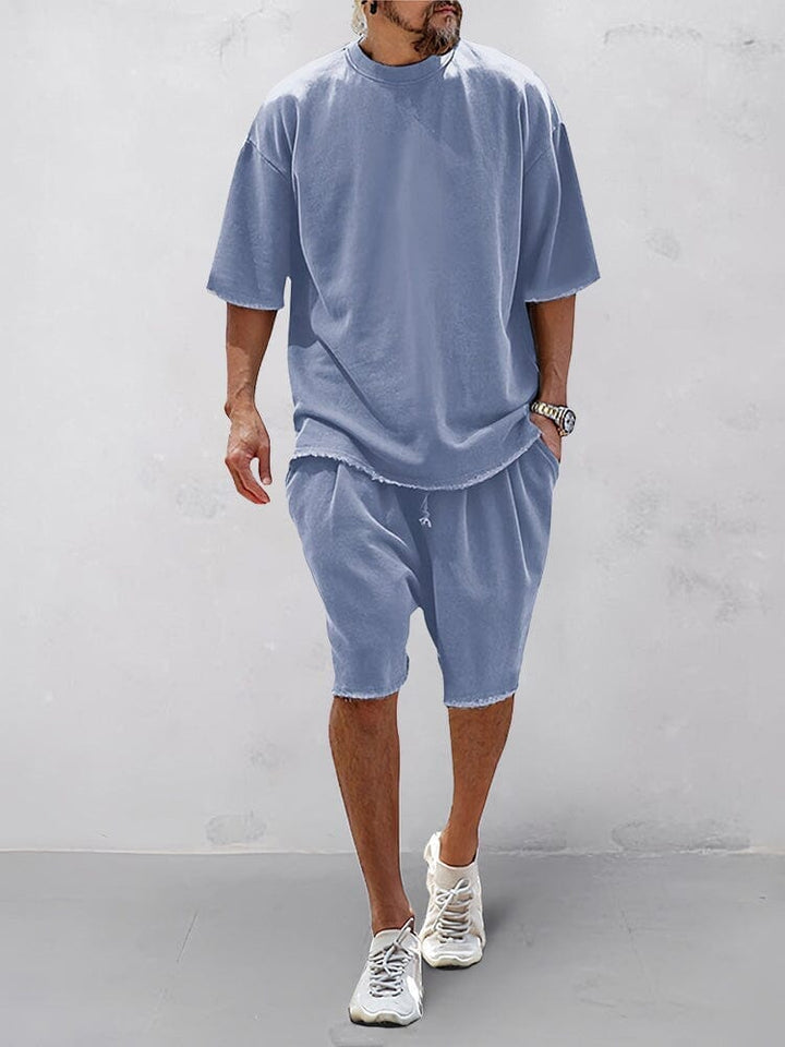 Einfarbiges Oversize Herren Sportset: Kapuzenpullover und Jogginghose für gemütliche Freizeit.