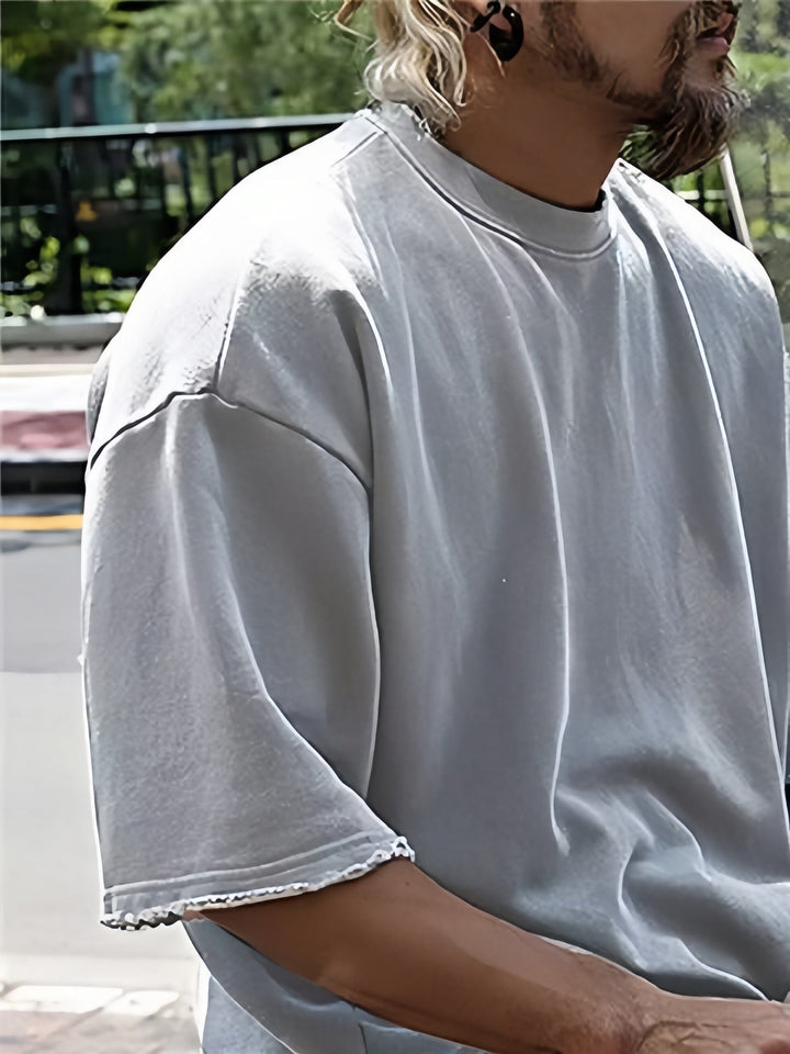 Graues einfarbiges Herren Athleisure-Set: Bequemer Oversize Kapuzenpullover & Jogginghose.