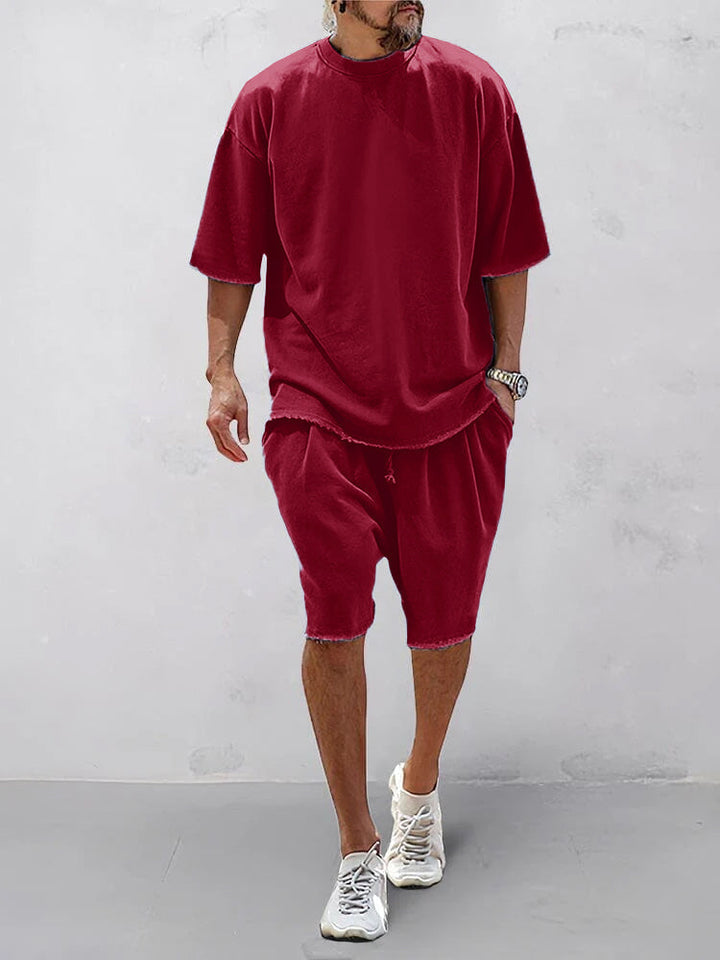 Oversize Herren Sportbekleidung: Unifarbener Hoodie und Jogginghose, komfortabel & modern.