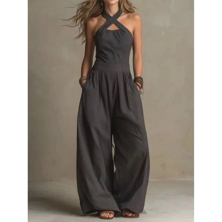 Damen Kreuz Halter Jumpsuit mit Cut-Outs und weitem Bein. Eleganter, luftiger Sommer-Overall in Schwarz.