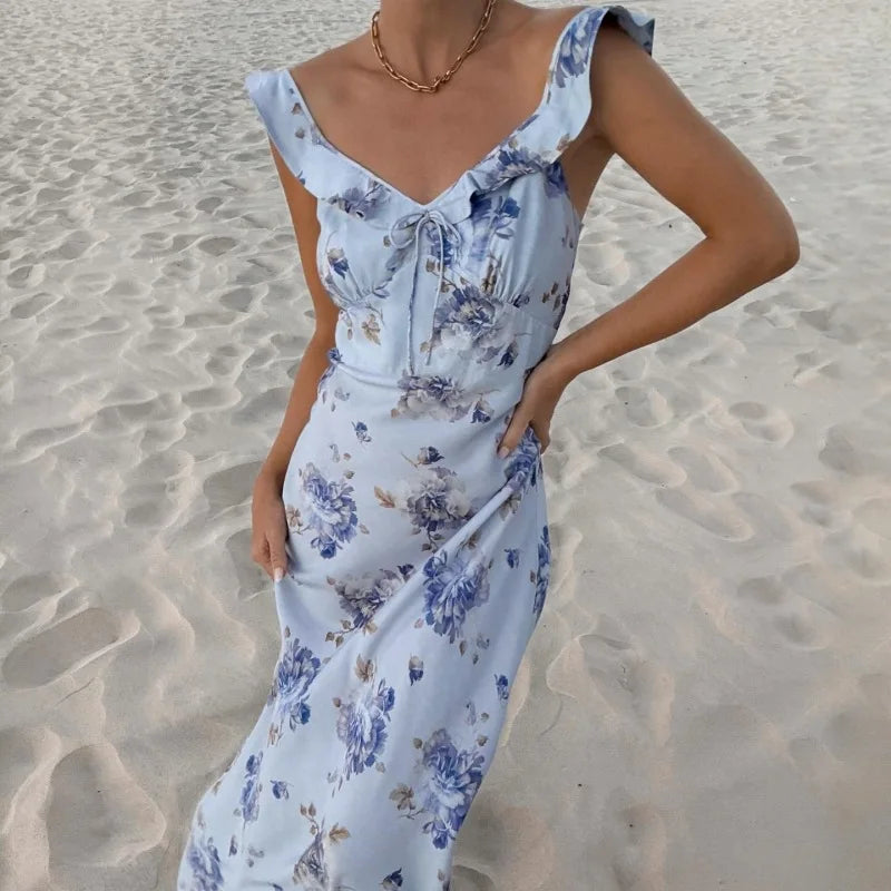 Luftiges Damen Maxikleid mit Blumenmuster in Gelb-Blau. Ein bequemes rückenfreies Sommer- & Strandkleid.