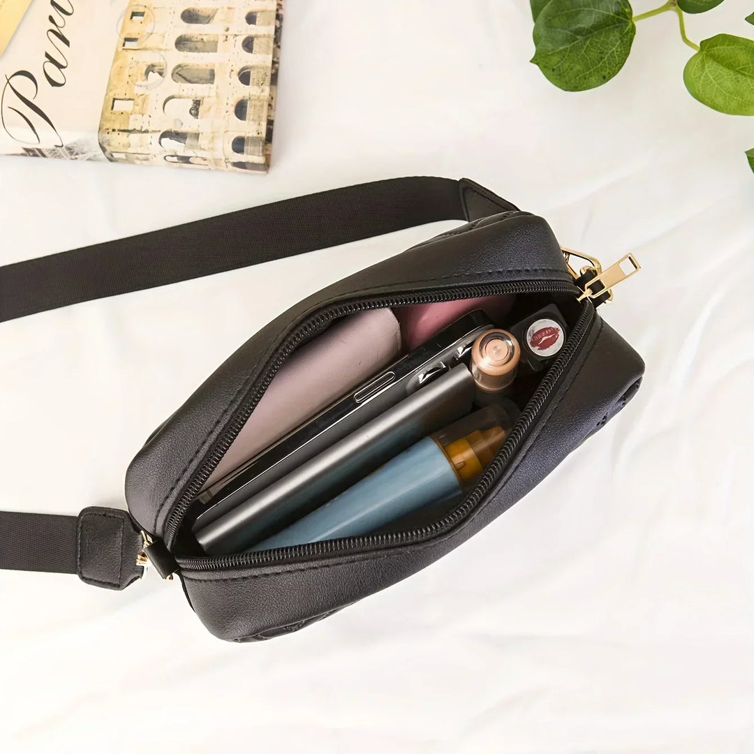 Elegante, gepolsterte Damen Umhängetasche Briaira aus Kunstleder, mit Platz für Handy und Geldbörse.