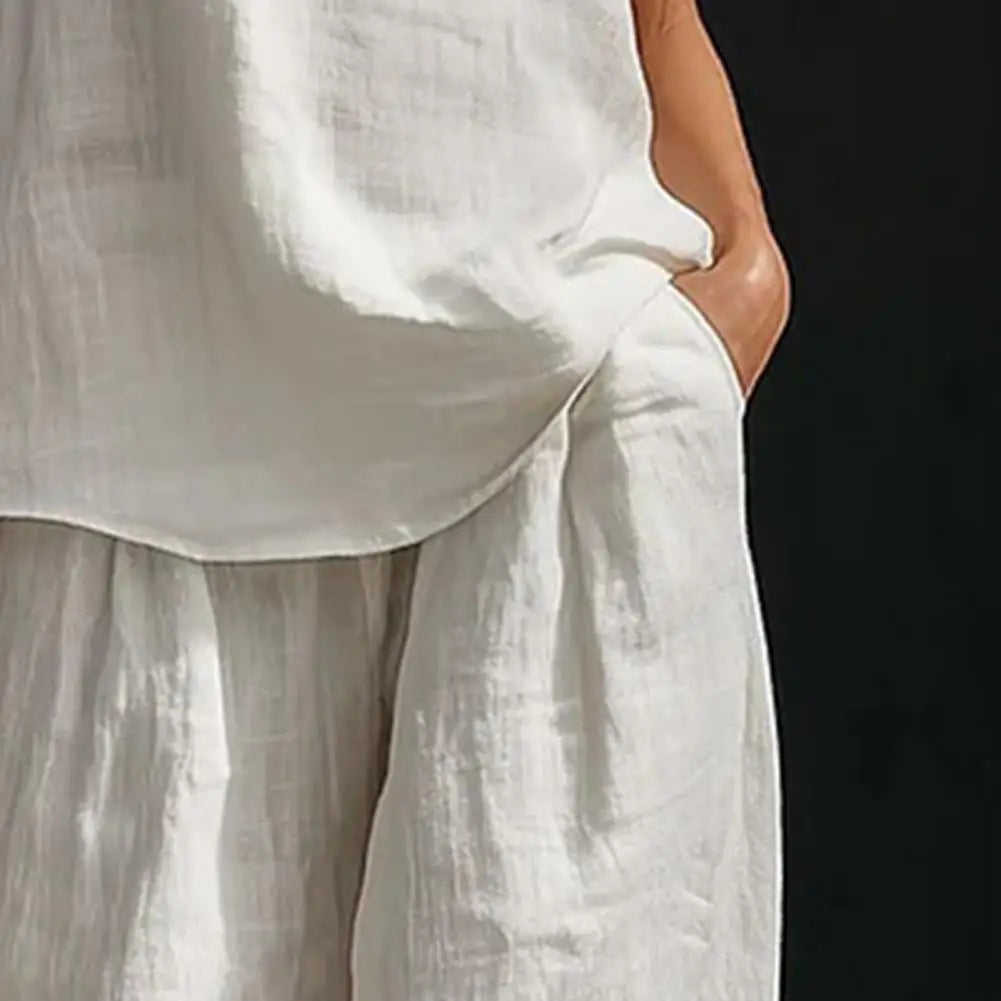 Vielseitiger Damen Zweiteiler: Fließendes V-Ausschnitt Top & High-Waist Hose. Bürotauglich, modisch & komfortabel für jede Frau.