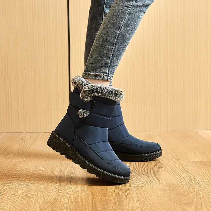 Komfortable und strapazierfähige Damen Slip-On Stiefel, wasserabweisend für Schnee und Outdoor-Aktivitäten.
