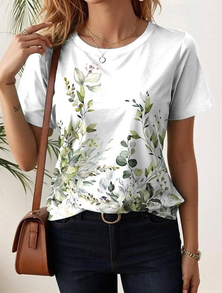 Damen Kurzarm Longshirt mit lebhaftem Blumen Grafik Muster. Luftiges und bequemes Sommer Oberteil für Freizeit.