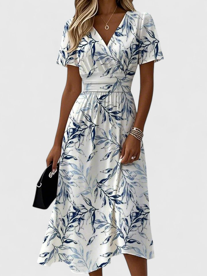 Damen Sommerkleid mit V-Ausschnitt, Blättermuster & fließender A-Linie, ideal für Freizeit & Strand.