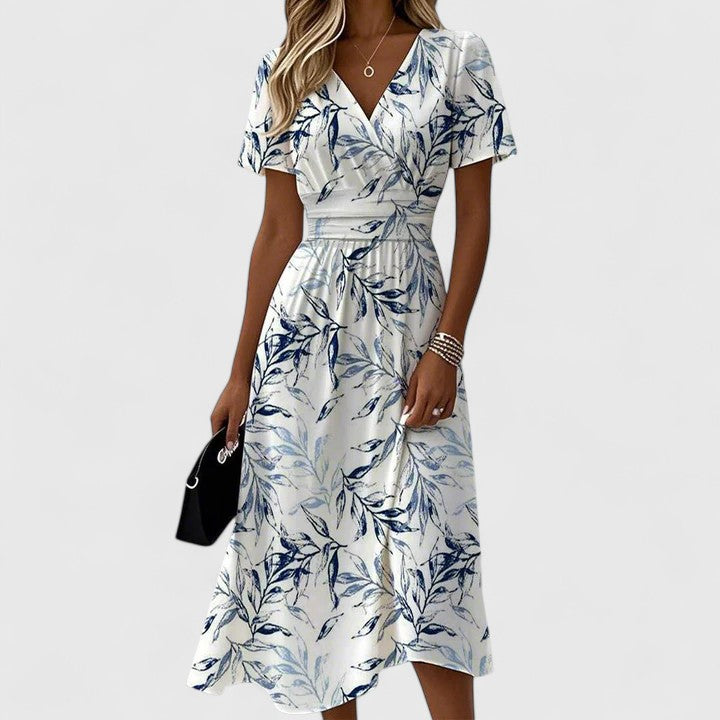 Elegantes Damen Midi Sommerkleid mit V-Ausschnitt und sommerlichem Blättermuster in bequemer A-Linie.