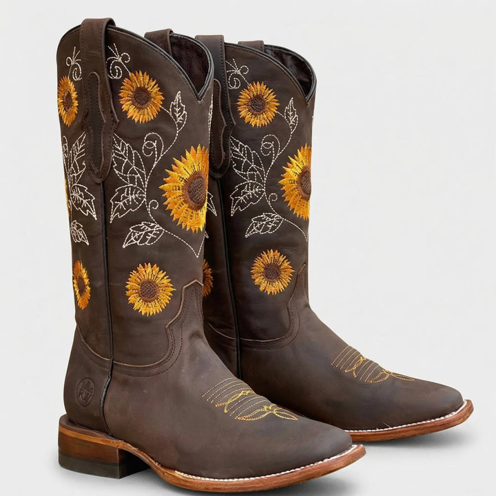 Festival-taugliche Damen Westernstiefel mit auffälliger Sonnenblumen-Stickerei, spitzer Zehe und stabilem Blockabsatz.