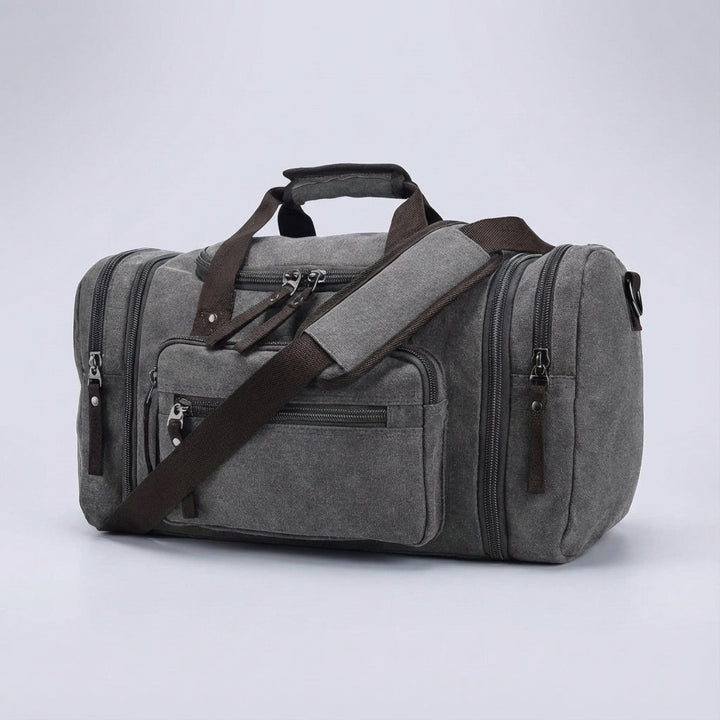 Blaue erweiterbare Unisex Canvas Wochenendtasche mit Schultergurt, ideal für Kurzreisen und Sport.