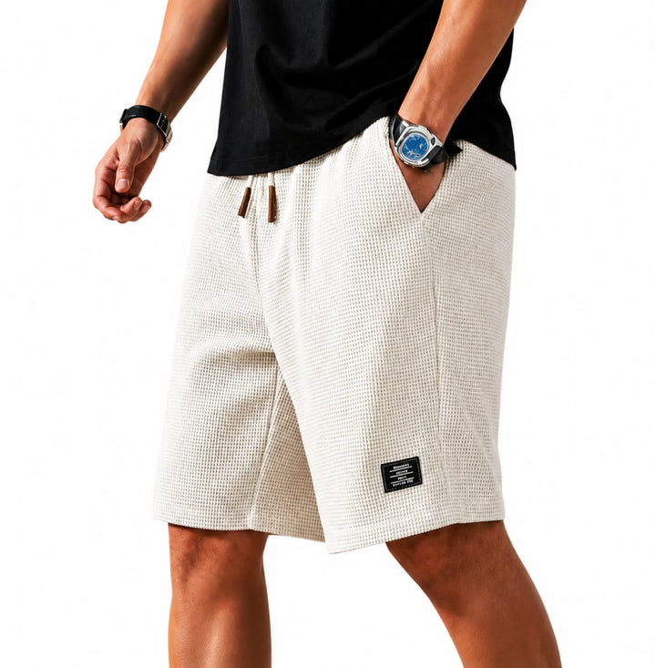 Vielseitige Herren Bermuda Shorts, moderne Passform, atmungsaktives Material, perfekt für heiße Tage.