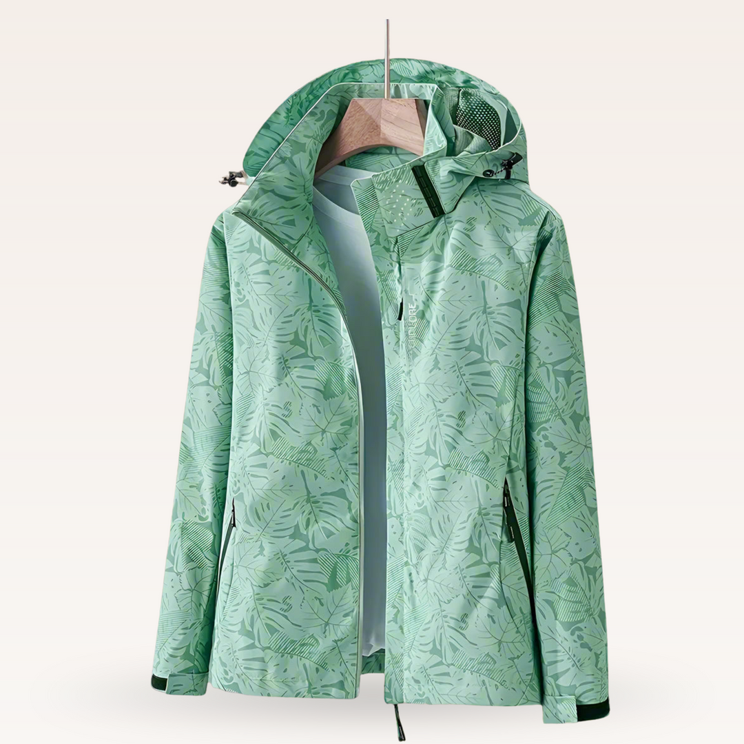 Leichte, winddichte Damenjacke mit Blattmuster. Wasserdichter Windbreaker mit verstellbarer Kapuze für Allwetter.