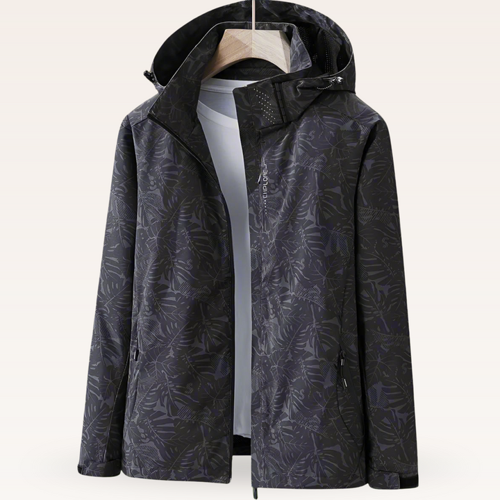 Vielseitige Damen-Regenjacke für Frühling & Sommer. Wasserdicht, mit ansprechendem Blattmuster & verstellbarer Kapuze.