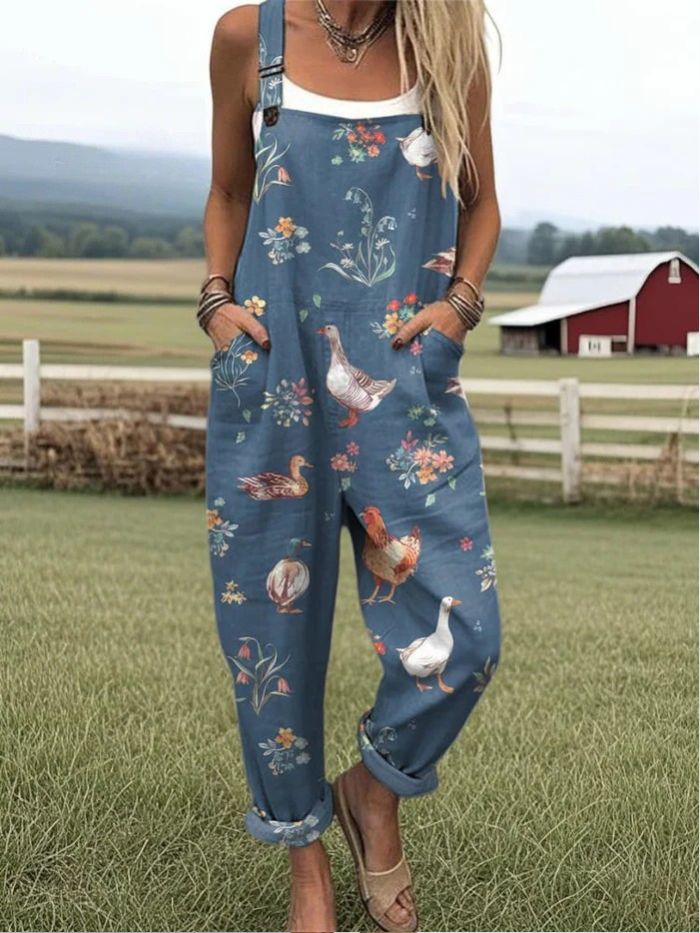Eleganter Damen Vintage Jumpsuit in Tiefseeblau mit Blumenmuster, weite Passform für Frühling & Sommer.