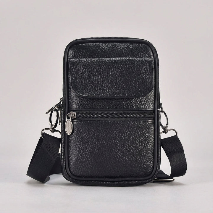 Offene LeatherLuxe Crossbody Ledertasche zeigt Organizer-Fächer. Praktische kleine Umhängetasche für Damen & Herren.