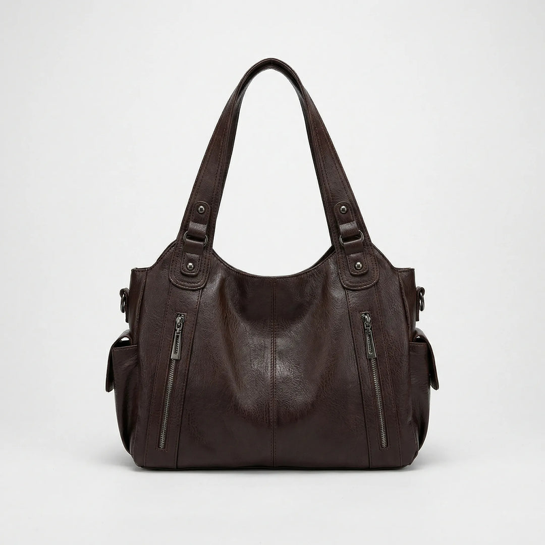 Schwarze Crossover Tasche Nikita für Damen, organisiert & stilvoll. Vielseitige Umhängetasche mit vielen Fächern.