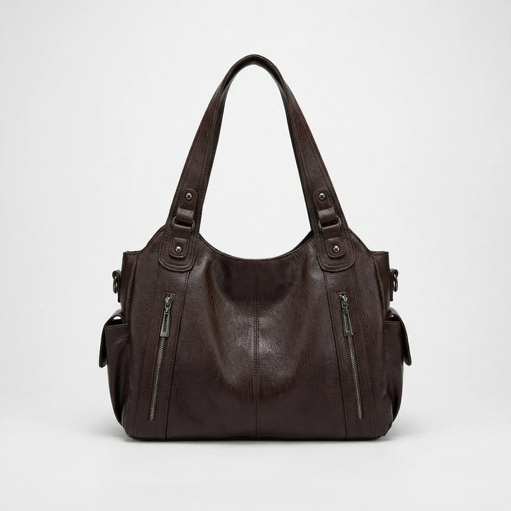 Schwarze Crossover Tasche Nikita für Damen, organisiert & stilvoll. Vielseitige Umhängetasche mit vielen Fächern.