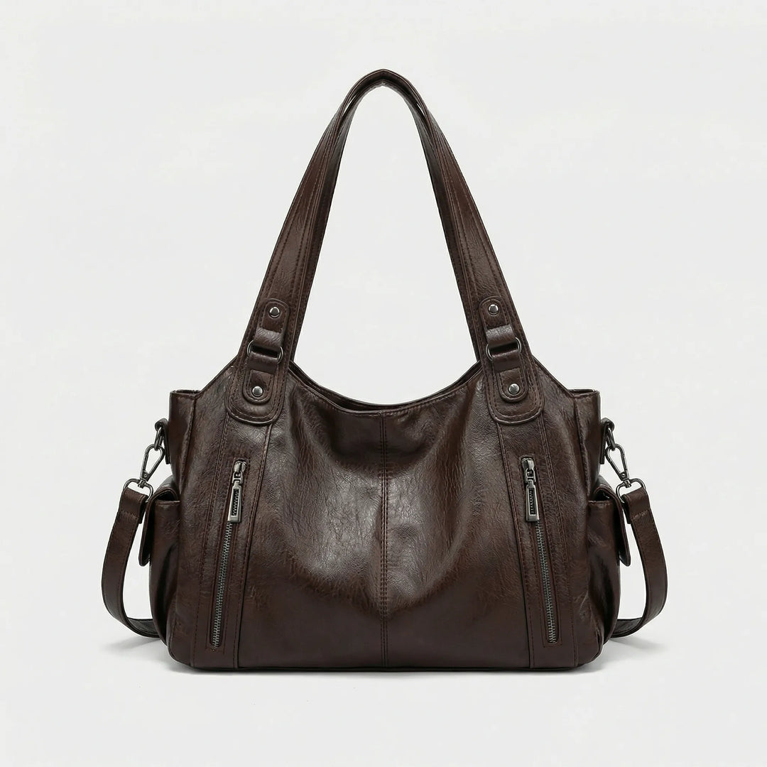 Praktische Organizer Tasche Nikita in Schwarz, eine vielseitige Crossover Handtasche für Damen. Elegant & funktional.