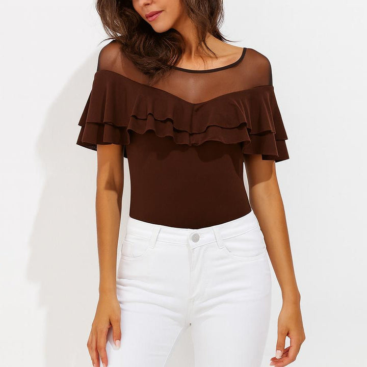 Damen Langarm Top mit stilvollen Raffungen und eleganten transparenten Details.