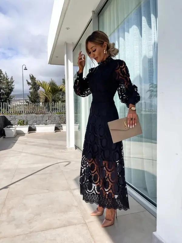 Vielseitiges schwarzes Damen Sommerkleid mit kurzen Puffärmeln, ideal für Freizeit & festliche Anlässe.