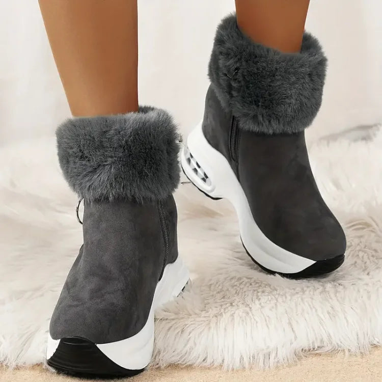 Vielseitige graue Damen Boots, wasserdicht & isoliert, mit rutschfester Sohle für sicheren Tritt.