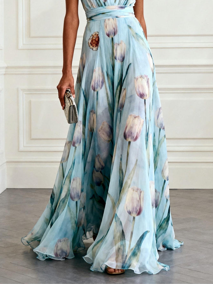 Nahaufnahme des floralen Tulpenmusters auf dem eleganten Damen Maxikleid mit V-Ausschnitt und fließendem Stoff.