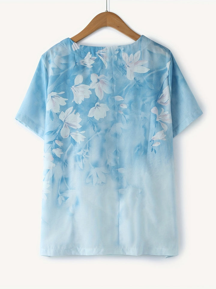 Sommerliche Vintage Damenbluse mit Knopfleiste, Rundhals und bezauberndem Blumenmuster.
