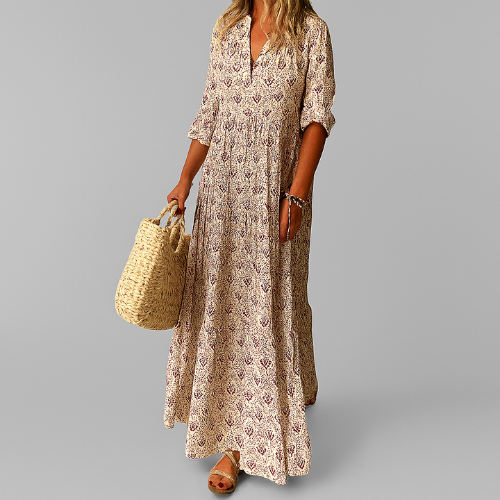 Blaues Damen Maxikleid mit Blumenmuster. Fließendes Sommerkleid im Boho-Stil, ideal für Party, Strand & Freizeit.