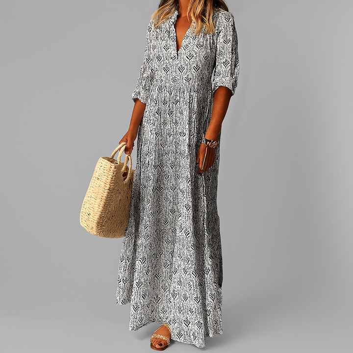 Graues Damen Blumen Maxikleid mit V-Ausschnitt. Elegantes A-Linie Boho-Kleid, perfekt als Sommer- oder Partykleid.