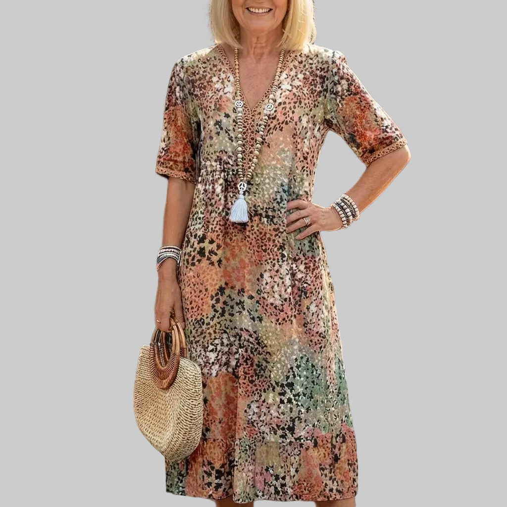 Damen Midi-Kleid mit Muster. Lockeres & bequemes Freizeitkleid mit V-Ausschnitt und Kurzarm.